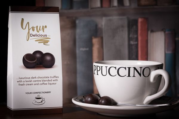 Chocolates and Coffee on White Background